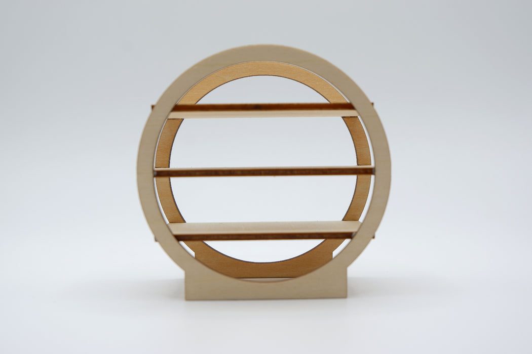 A minimalist circular wooden shelf with three horizontal slats and a matching rectangular base, shown against a seamless light gray studio background.