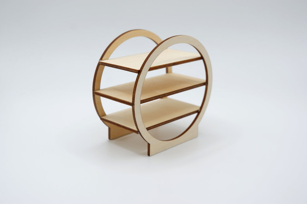 A small wooden display shelf with three tiers and an open circular frame design, shown on a light gray studio background.
