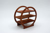 A three-tier wooden display shelf with a circular frame design, made from medium brown wood with a visible grain, photographed on a seamless white background.